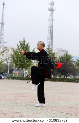 Luannan - September 20: an old man fencing in cultural activities square, the performance on September 20, 2014, the south of the luanhe river, hebei, China.