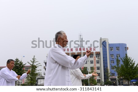 Luannan - September 20: man in performing tai chi chuan in cultural activities square, on September 20, 2014, the south of the luanhe river, hebei, China.