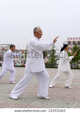 Luannan - September 20: man in performing tai chi chuan in cultural activities square, on September 20, 2014, the south of the luanhe river, hebei, China.