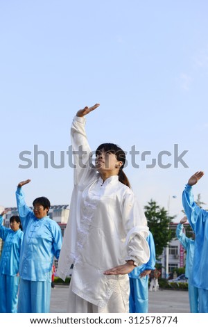 Luannan - June 14: taijiquan woman individual performances of close-up square in the center of the literary style, June 14, 2014, luannan county, hebei province, China.