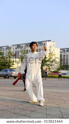 LUANNAN - JUNE 14: square in the center of the literary style men's fencing individual performances, June 14, 2014, luannan county, hebei province, China.