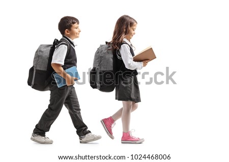 Similar – Image, Stock Photo Two schoolgirls reading books in school library. Primary school students learning from books. Pupils doing homework. Children having fun in school club. Back to school