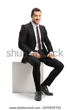 Similar – Image, Stock Photo Stylish man sitting at airport with suitcase and laptop, working, typing, browsing. Businessman traveling.