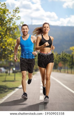 Similar – Foto Bild Sportler laufen auf Asphaltstrasse in den Bergen