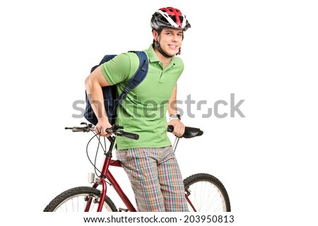 Studio shot of young man with a backpack and bike isolated on white background