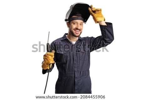 Image, Stock Photo A man welder with construction gloves and a welding mask hard work and welds with a welding machine metal in workshop, close up