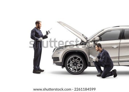 Image, Stock Photo Male mechanic checking car engine in service