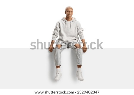 Similar – Image, Stock Photo Teenager with hoodie in front of a dotted concrete wall