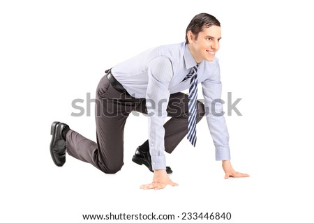 Happy businessman ready to run isolated on white background