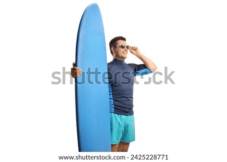 Similar – Image, Stock Photo Surfer standing at the beach with surfboard