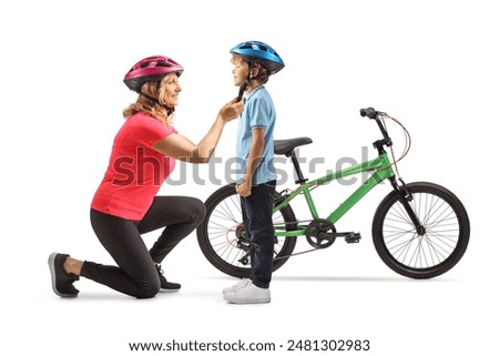 Similar – Image, Stock Photo Mother putting bicycle helmet on her son