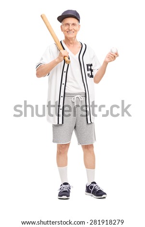 Full length portrait of an active senior in baseball jersey holding a baseball bat and a ball isolated on white background