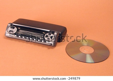 Car stereo CD player against brown background
