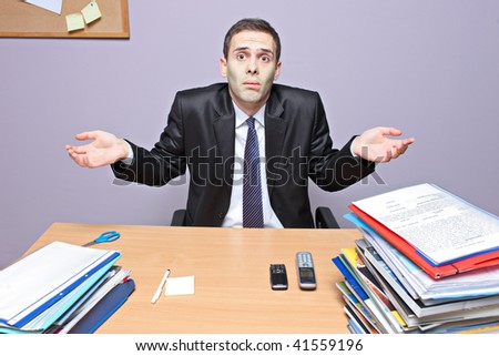 Confused businessman in an office