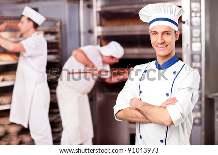 Portrait of a chef standing inside a bakery
