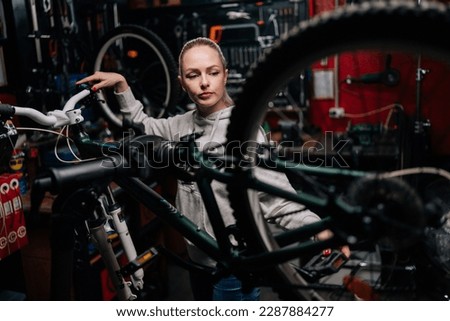 Similar – Image, Stock Photo Focused craftsman repairing handlebar with fire