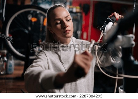 Similar – Image, Stock Photo Focused craftsman repairing handlebar with fire