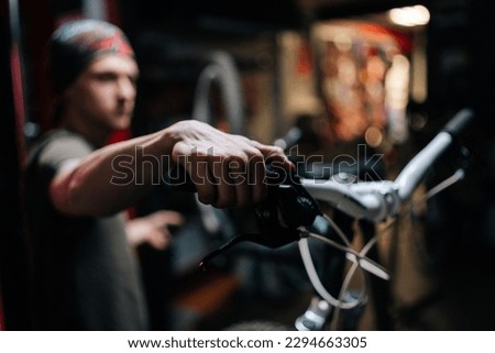 Similar – Image, Stock Photo Focused craftsman repairing handlebar with fire