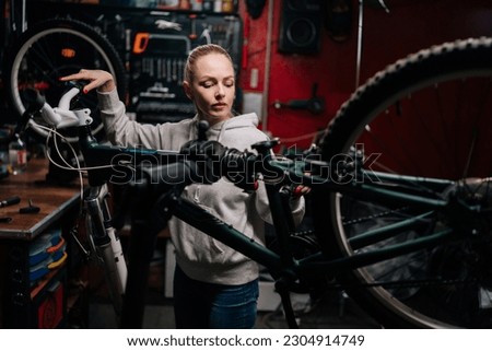 Similar – Image, Stock Photo Focused craftsman repairing handlebar with fire