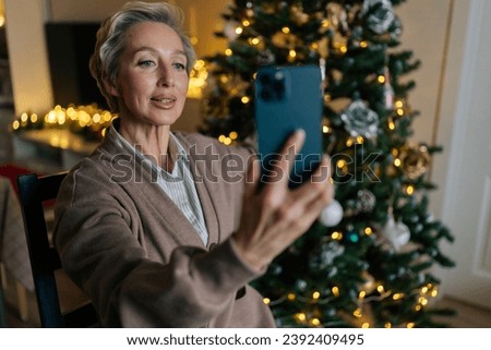 Similar – Image, Stock Photo Happy adult woman taking selfie on top of mountain