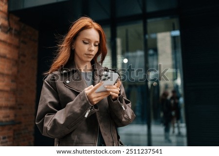 Similar – Image, Stock Photo Serious woman browsing smartphone at home