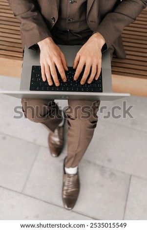 Similar – Image, Stock Photo Crop male entrepreneur browsing cellphone on street