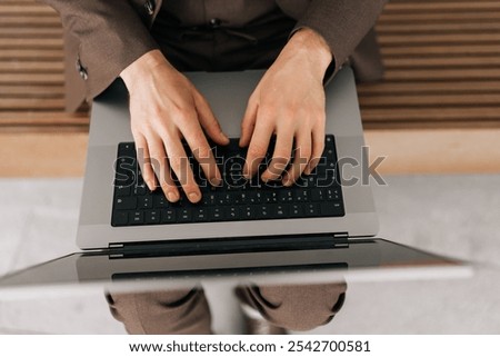 Similar – Image, Stock Photo Crop male entrepreneur browsing cellphone on street