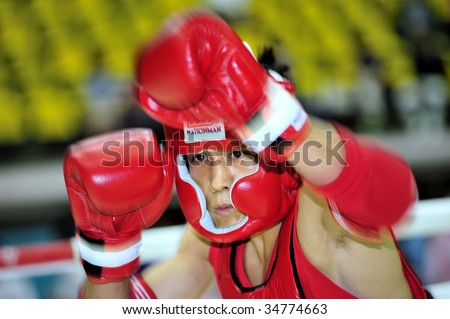 BANGKOK - AUG 2: Nguyen Tran Dug Nhat of Vietnam warms up at Thai boxing event during the 1st Asian martial arts games 2009 August 2, 2009 in Bangkok, Thailand.