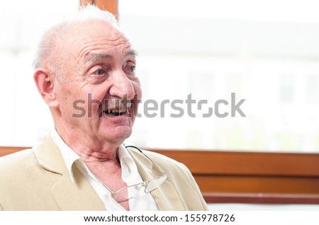 Closeup Profile on a Smiling Old Man