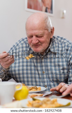 Old man eating a healthy meal