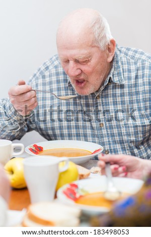 Senior man eating a healthy meal