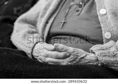 old woman's hands joined together