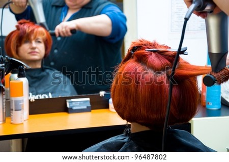 women having her hair cut