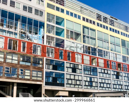 AMSTERDAM, NETHERLANDS - JUNE 6, 2015: Modern colorful social housing apartment building Silodam alongside IJ in Amsterdam, Netherlands