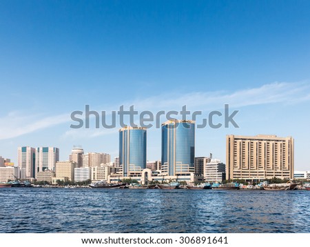 DUBAI, UNITED ARAB EMIRATES (UAE) - JAN 26, 2014: Dhows on the Creek,  Deira Twin Towers (Rolex Towers) in Rigga Al Buteen