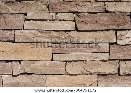 Brown Stone Tile Texture Brick Wall.