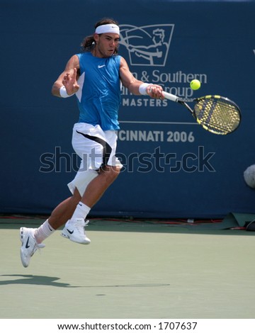 Professional Tennis Player Rafael Nadal hitting a forehand