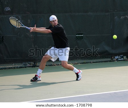 Professional Tennis Player Andy Roddick hitting a forehand