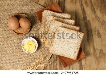 Similar – Image, Stock Photo Homemade toasted bread with fried egg, spinach and aromatic herbs