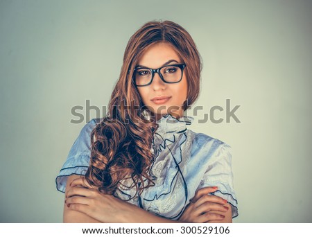 Attractive serious confident young businesswoman student, teacher. Business person  folded hands isolated  isolated green background. Portrait close up. Negative human emotion face expression feeling.