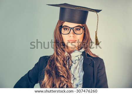 Portrait closeup beautiful confident latina graduate, graduated student girl, young woman in cap gown isolated green background wall. Celebrating graduation ceremony photo concept