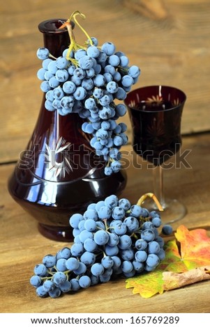 Vine bunches,  carafe with wine  and glass