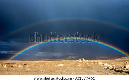 Double rainbow in the Tibet plateau upon a temple