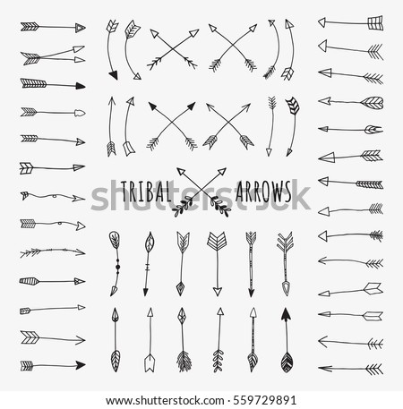 Hand drawn arrows set. Doodle tribal vectors isolated on off-white background.