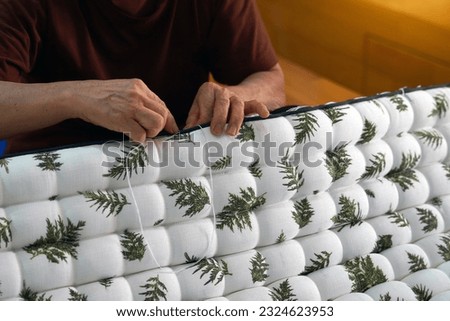 Similar – Image, Stock Photo Person sewing the spine of a book