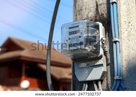 Image, Stock Photo Power poles in front of evening sky, taken through a power pole in the foreground, cropped, orange-black