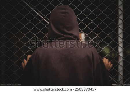 Image, Stock Photo Teenager with hoodie in front of a dotted concrete wall