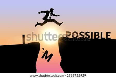 Businessman jumping over impossible and possible wording on cliff with cloud sky and sunlight silhoette