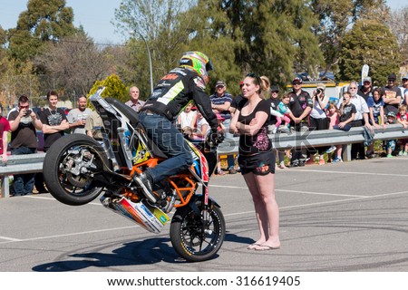 VICTORIA/AUSTRALIA - SEPTEMBER 2015: Stunt motorcycle rider performing at a local car show on the 13 September 2015 in Corowa.