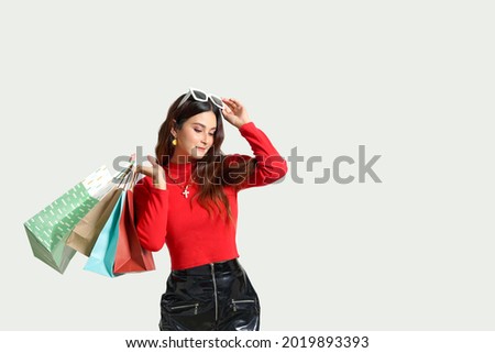 Young attractive brunette woman with shopping bags. Concept Compulsive shopping  Retail therapy addiction.Financial discipline.Friday night on sale. Woman and shopping. ストックフォト © 